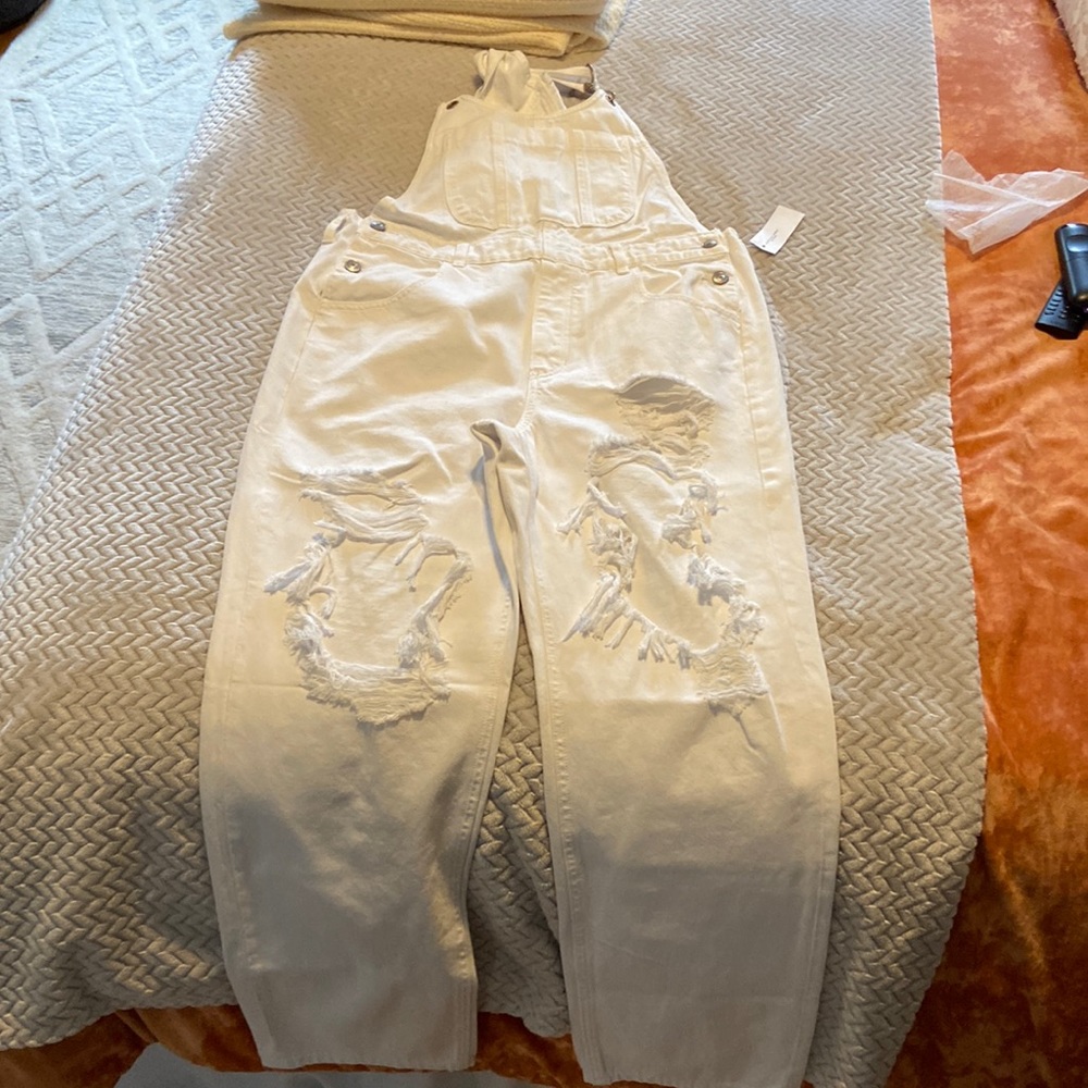 American Eagle white distressed overalls